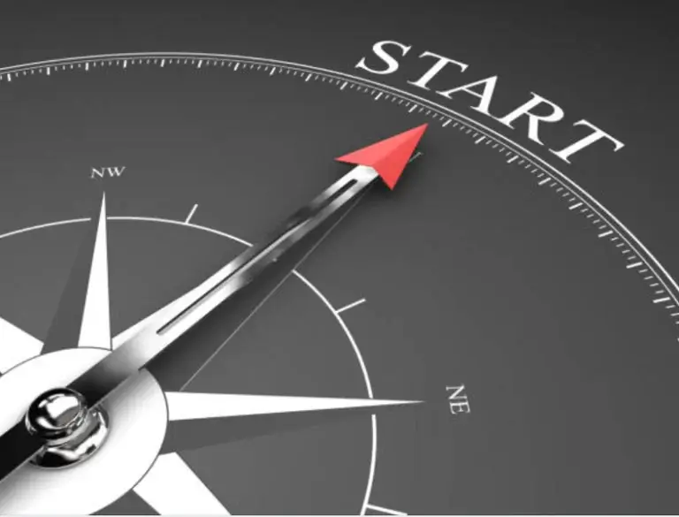 A compass with a red arrow pointing directly to the word 'START', symbolizing the beginning of a new journey.